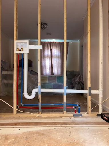 Rheem water heater installation with copper piping and expansion tank